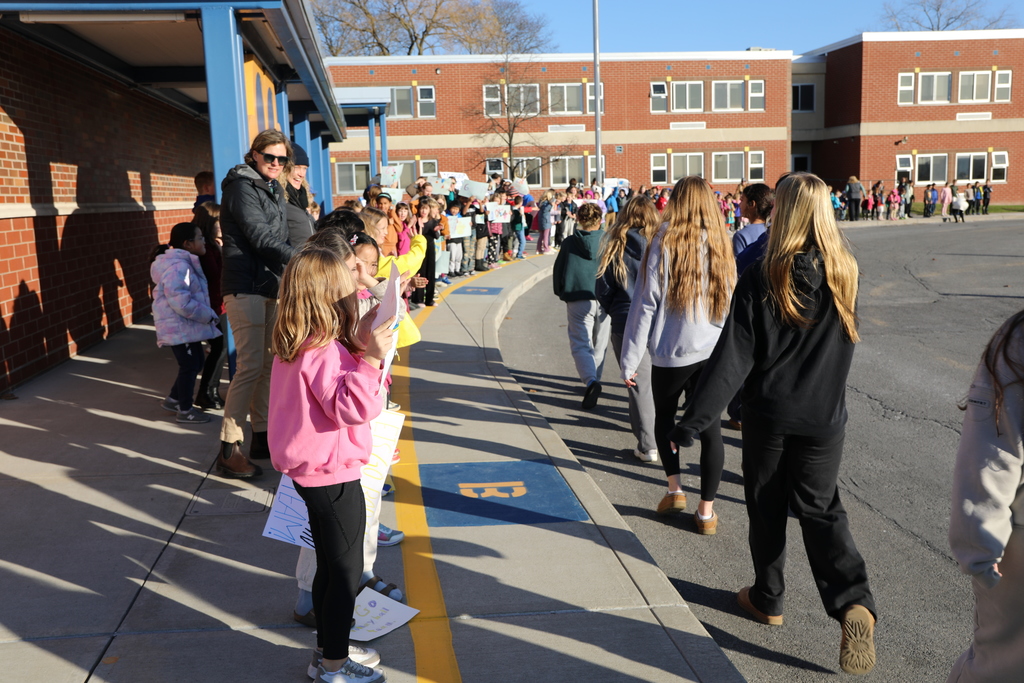 the volleyball team walking by the Elementary School
