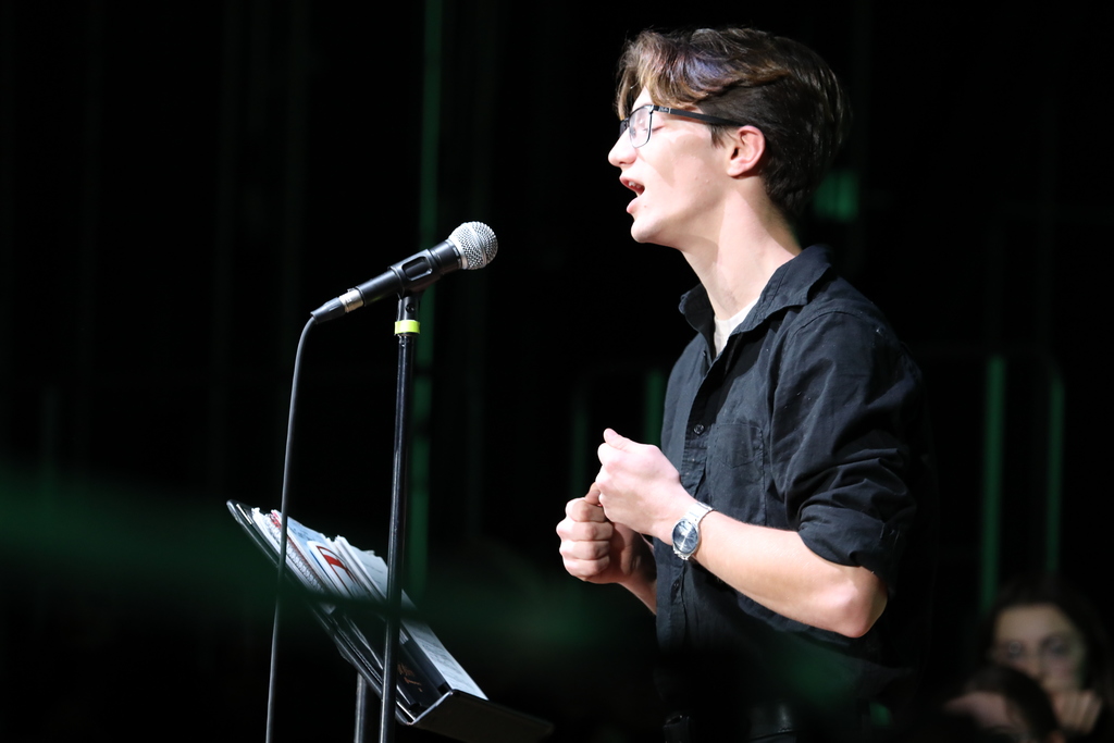 A student singing solo