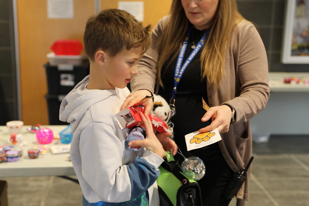 A student piling up all the gifts he is getting