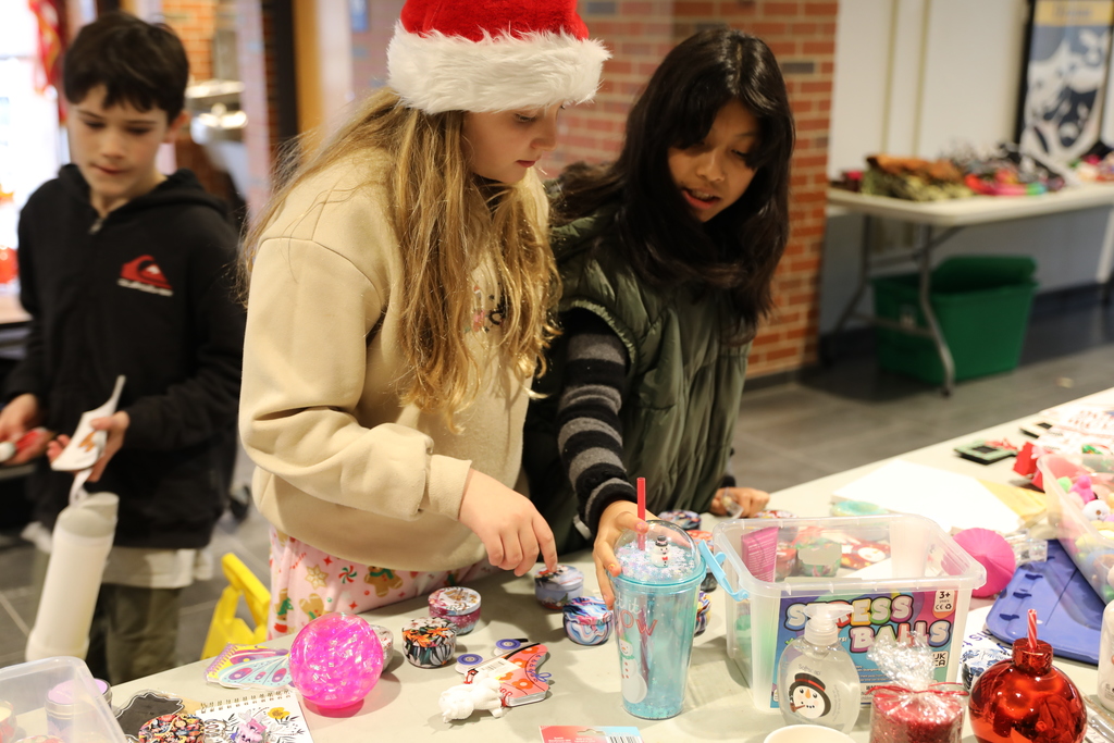 two students looking at gifts