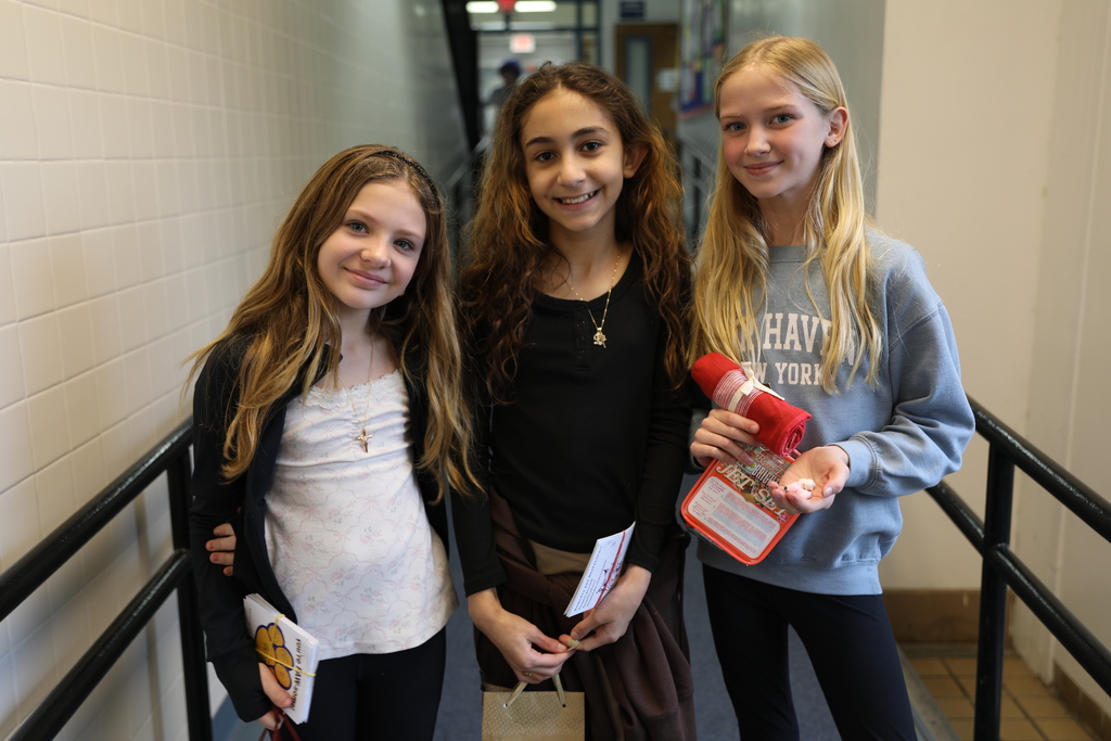 three students posing for a picture 