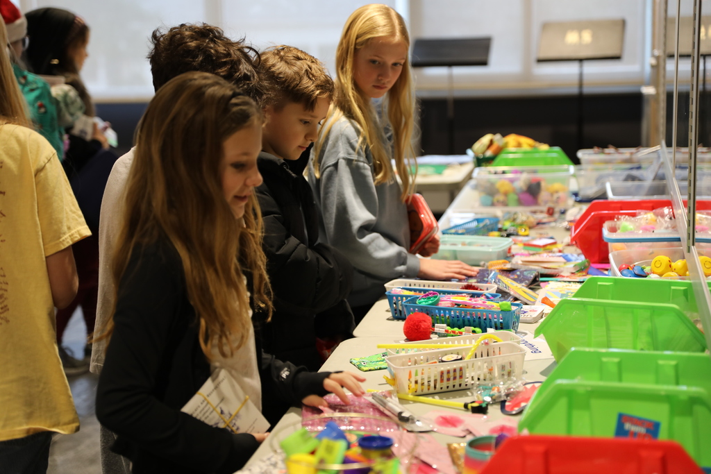a group of students looking at gifts