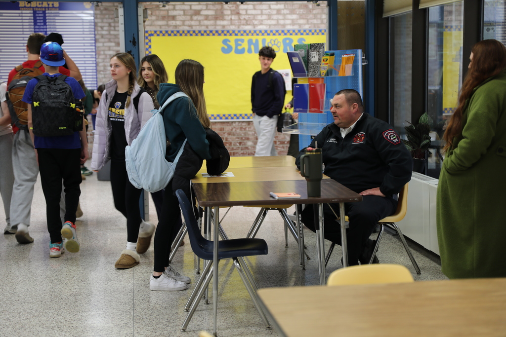 A student having a discussion with the Fire Chief about career possibilities