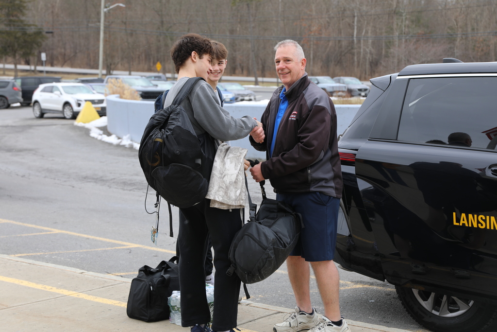 The wrestling students greeting their driver
