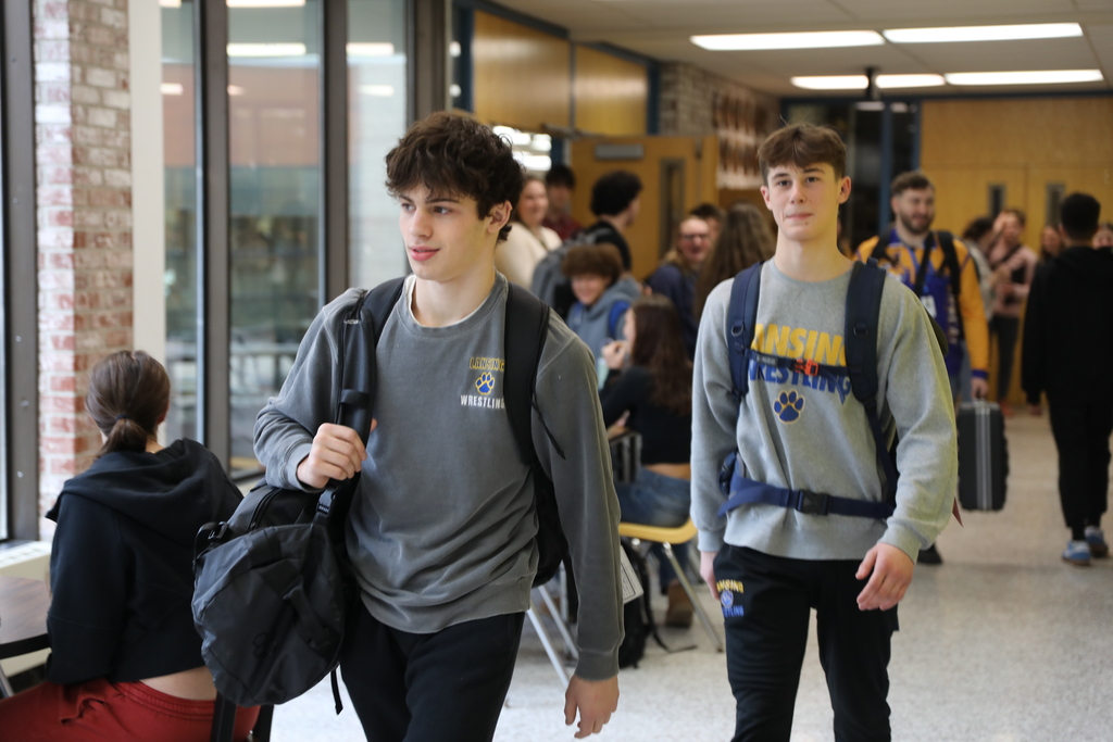 two of the wrestling students walking down the hall