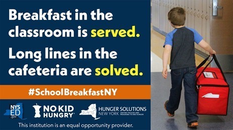 Breakfast in the  classroom is served. Image of student carrying a breakfast transportation bag. 