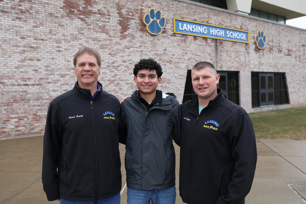 student and staff posing for a photo