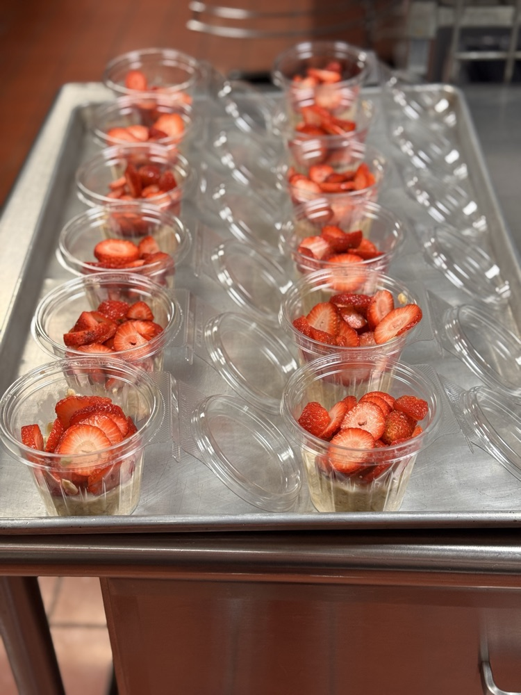 overnight oats in preparation on counter strawberry cream 