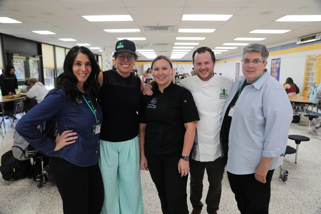 A group of Lansing staff and Chef Ann representatives posing for the camera
