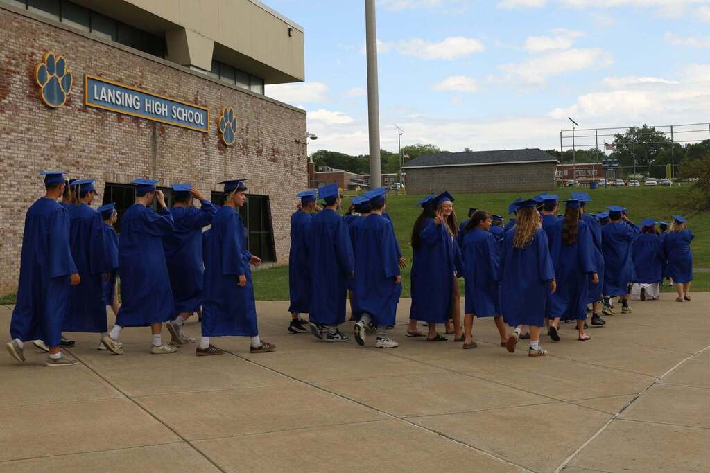 the senior class heading off to their walk from the high school
