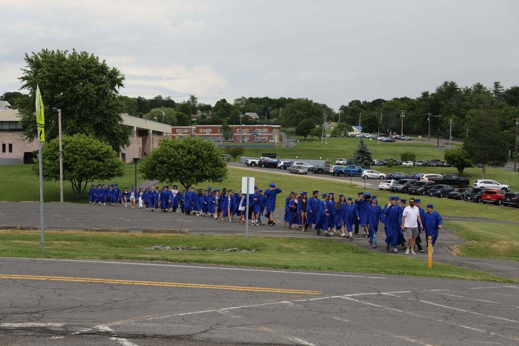 the senior class walking down to the middle school