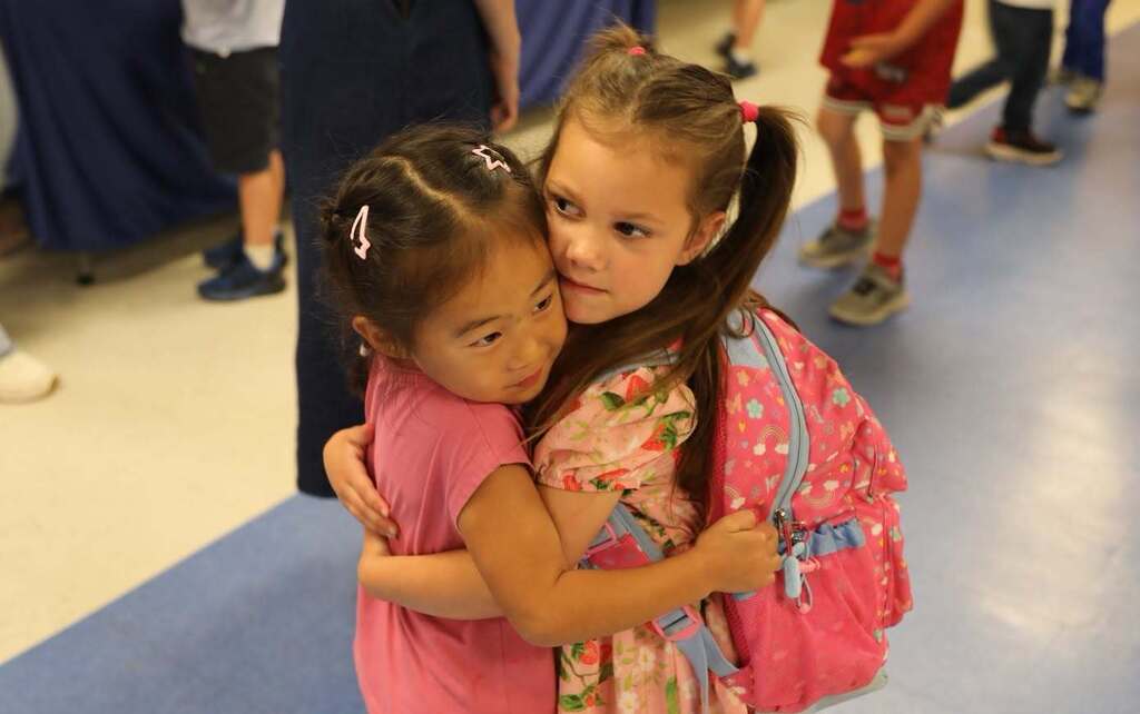 two students hugging