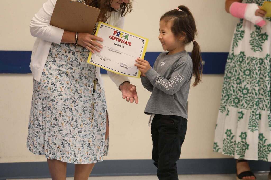 A student receiving a certificate