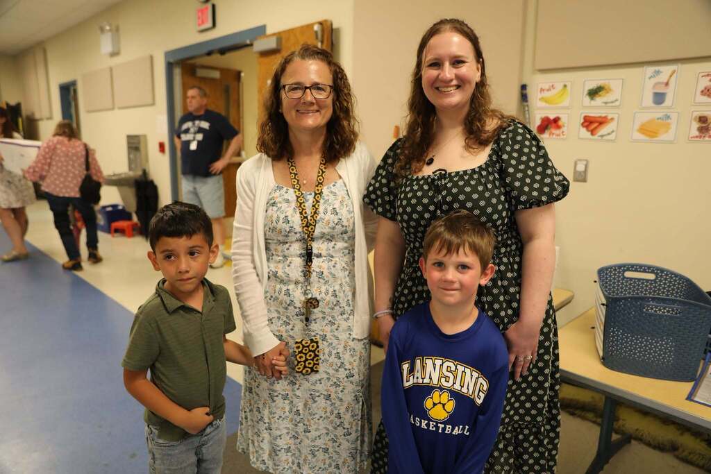 staff and students posing for the camera