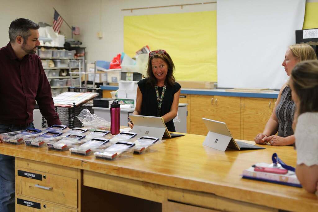four staff members planning for the start of the year