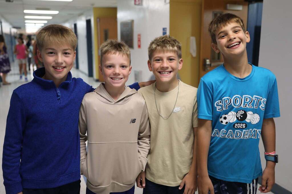four students posing for the camera
