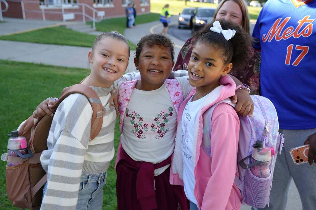 three students posing for the camera