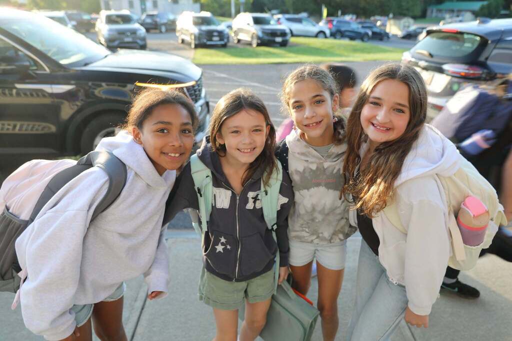 four students posing for the camera