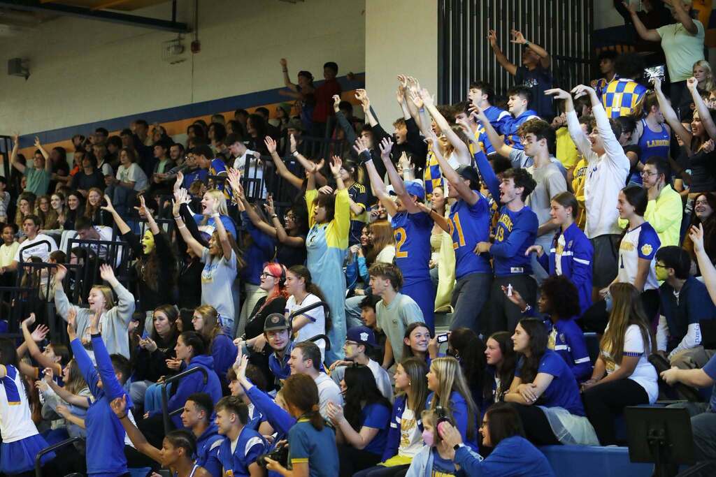 the crowd cheering at the pep rally