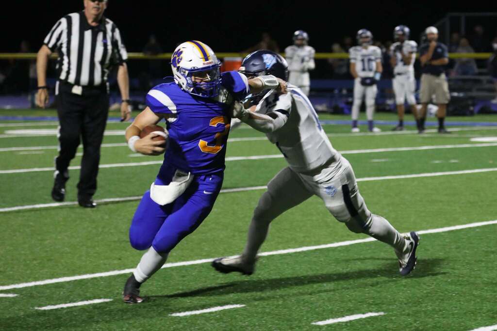 a football player getting around a defender