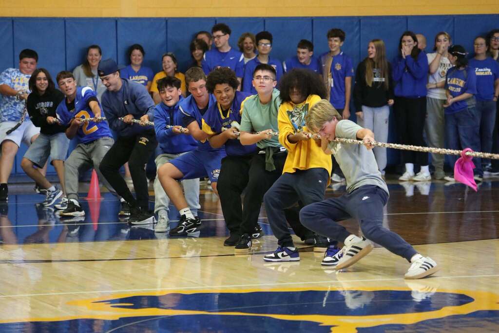 a group of students playing in a tug-of-war match