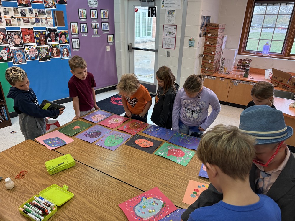 students judging artwork