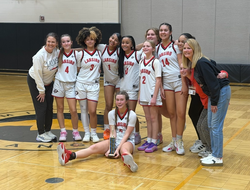 The Lansing 8th grade girls’ basketball team finished an unforgettable season in the best possible way—undefeated and crowned 2025 KVL Girls’ Basketball Champions. The team capped off their dominant run by bringing home the championship trophy, securing a well-earned back-to-back (2-Peat) KVL title.  Led by Head Coach Bishop and Assistant Coach Hamilton, the Lions played with energy, confidence, and relentless effort all season long. Their dynamic style of play and strong team connections made every game exciting to watch and showcased the dedication and hard work that defined this group.  The road to the championship wasn’t without challenges. In the semifinal matchup against Mill Creek, the Lions faced a tight contest that came down to the final moments. With the game tied late in the fourth quarter, Reese Anderson stepped to the free-throw line with everything on the line.  “I knew when I was fouled that the game was on the line, but Coach Bishop always says when I make shots there’s no shot bigger, so I knew I had to hit them—and I did,” Anderson said.  Coach Bishop praised the team’s resilience and ability to respond under pressure.  “During the Mill Creek game in the semis, we faced a lot of adversity. They’re a well-coached team that always gives us all we can handle,” Bishop said. “After being down to start the fourth quarter, we kicked it up a notch and found ways to get steals and baskets. Reese and Allie both hit important free throws to put us up at the end of that game.”  In the championship game, the Lions left no doubt. The team applied constant defensive pressure and capitalized on key scoring opportunities to pull away and secure the title.  “When we played in the championship match, we never let up,” said Maliyah Davis. “We just kept playing pressure defense and hit some big shots to increase our lead. We were so excited to 2-Peat!”  Assistant Coach Hamilton echoed the pride felt by the entire Lansing community.  “I’m so proud of this team,” Hamilton said. “They worked hard all season and deserved the championship.”  Congratulations to our coaches and players, and to the reigning KVL Champions. This undefeated season is a testament to leadership, teamwork, and determination—and one that will be remembered with pride.