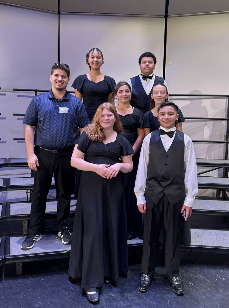 Six Lansing Middle School singers earned a spot in this year’s Northeast Kansas Music Educators Association (NEKMEA) Middle-Level District Honor Choir, representing LMS among some of the region’s most talented young vocalists.  Over the weekend, students traveled to participate in the prestigious event, which brought together approximately 170 middle-level singers from 34 schools across Northeast Kansas. The honor choir experience gives students the chance to rehearse and perform high-level choral music alongside peers from other districts, all under the direction of a guest clinician.  LMS students selected for the 2025 NEKMEA Middle-Level District Honor Choir included:  Amara Robinson (8th grade)  Dominick McNeal (8th grade)  Leah Nickelson (8th grade)  Kinley Hawks (8th grade)  Dakota Vaughan (8th grade)  MJ Carson (7th grade)  During the day-long clinic and performance, students worked with nationally recognized composer and conductor Ryan Main, who led rehearsals and also composed several pieces featured in the concert. His guidance challenged students musically while also giving them an inside look at the creative process behind choral performance.  “This was an incredible experience for our singers,” said LMS choir staff. “It was a great day for music making and a great day to be a Lion.”  Congratulations to Amara, Dominick, Leah, Kinley, Dakota, and MJ for their hard work, dedication, and outstanding representation of Lansing Middle School. Their selection to NEKMEA Honor Choir reflects both their individual talent and the strength of the LMS choral program.