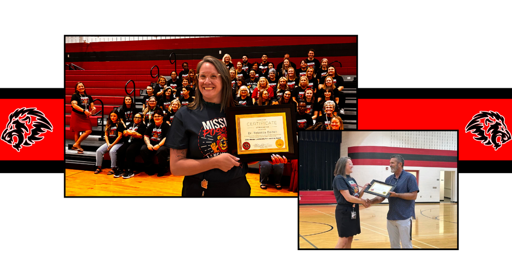 Lansing Elementary School asst principal accepting award in front of staff