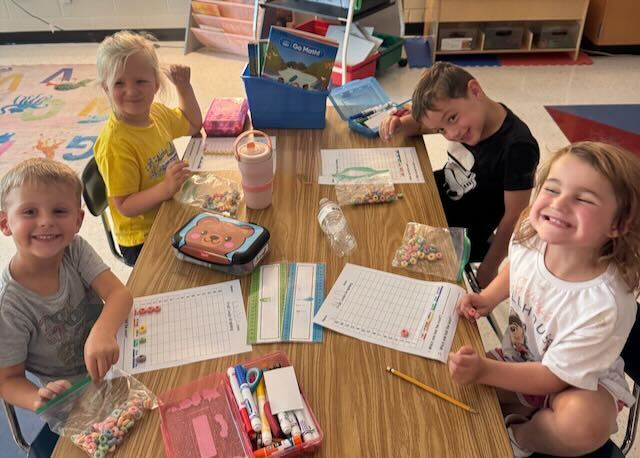 First Graders at their desks in a classroom