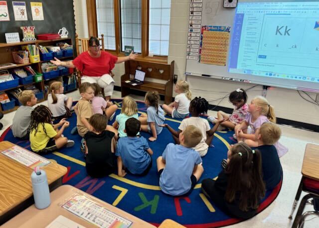 First Graders at their desks in a classroom