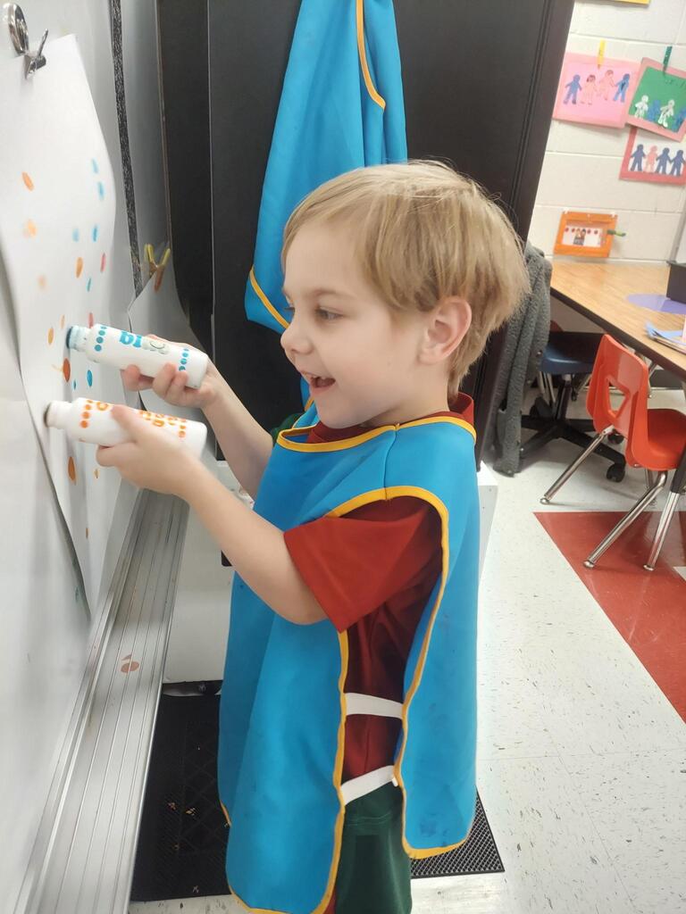 Preschoolers celebrating dot day in their classroom