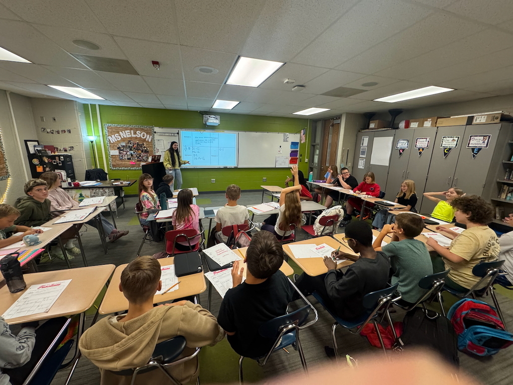 Students listening to a math lesson in a classroom