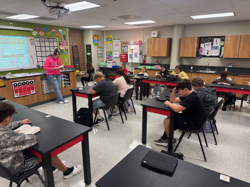 Teacher reading with her class