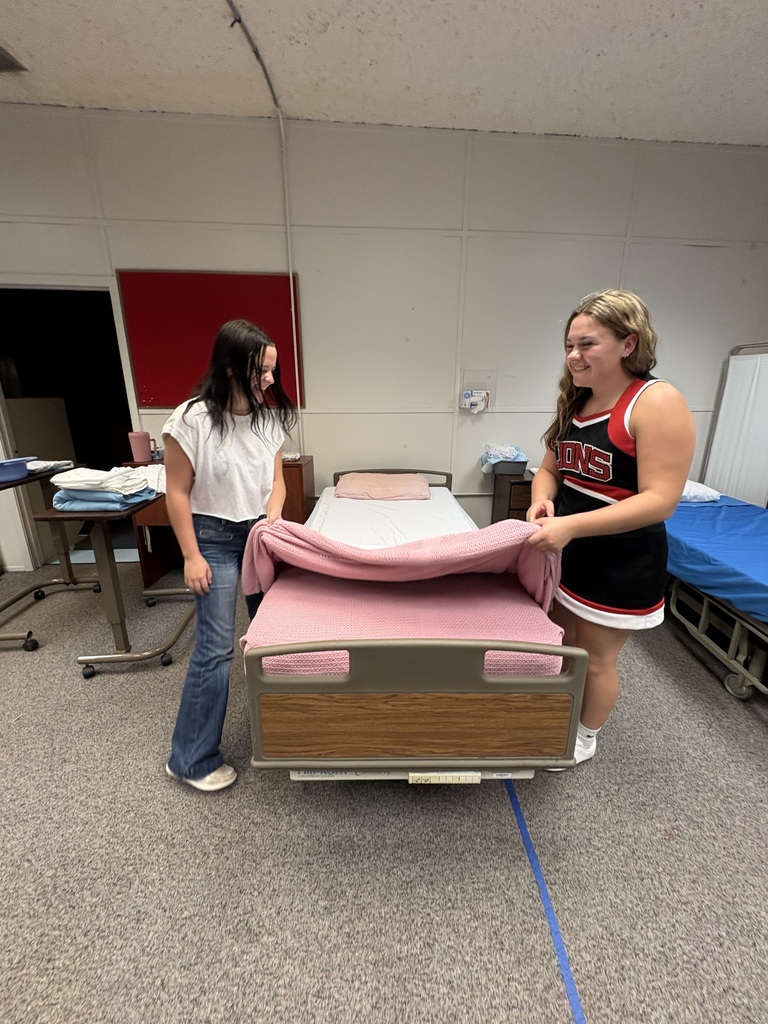 CNA Students learning hot to make occupied and unoccupied beds safely and efficiently