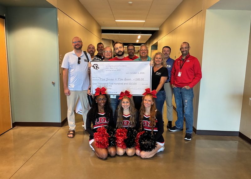 Teacher receiving grant from educational foundation