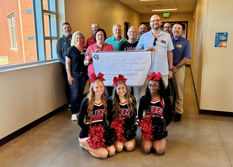Teacher receiving grant from educational foundation