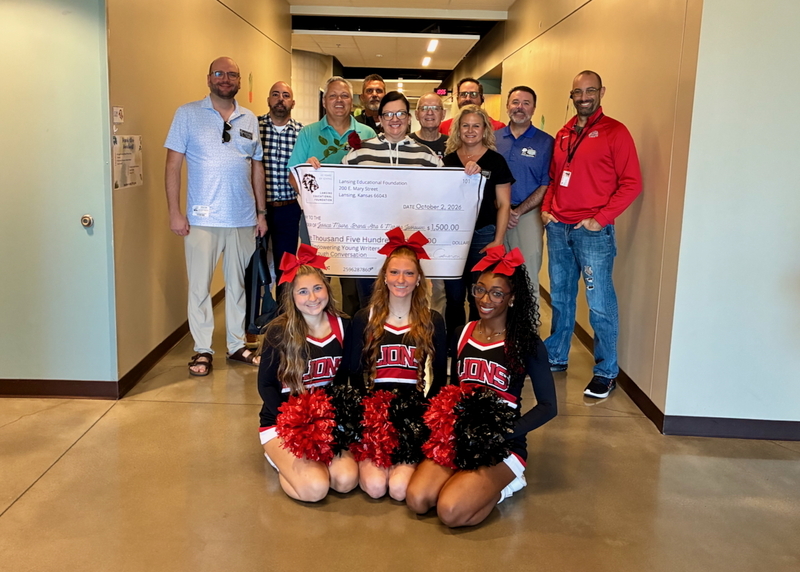 Teacher receiving grant from educational foundation