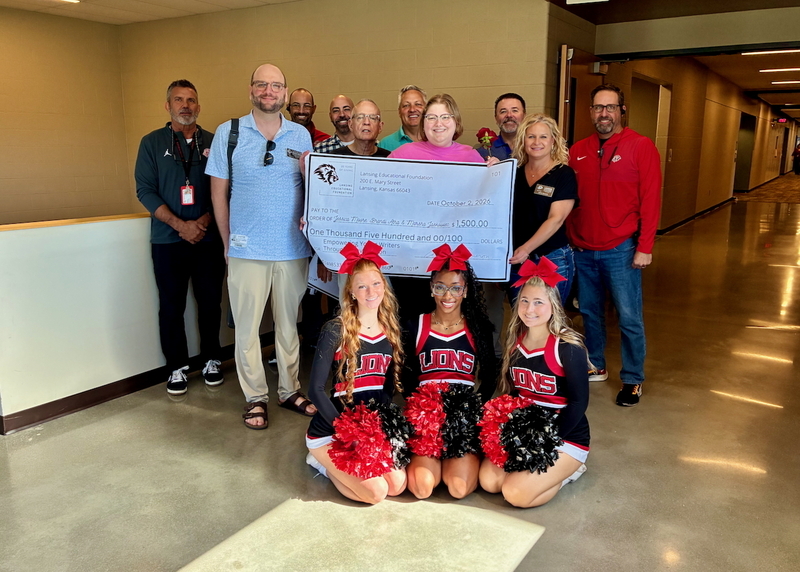 Teacher receiving grant from educational foundation