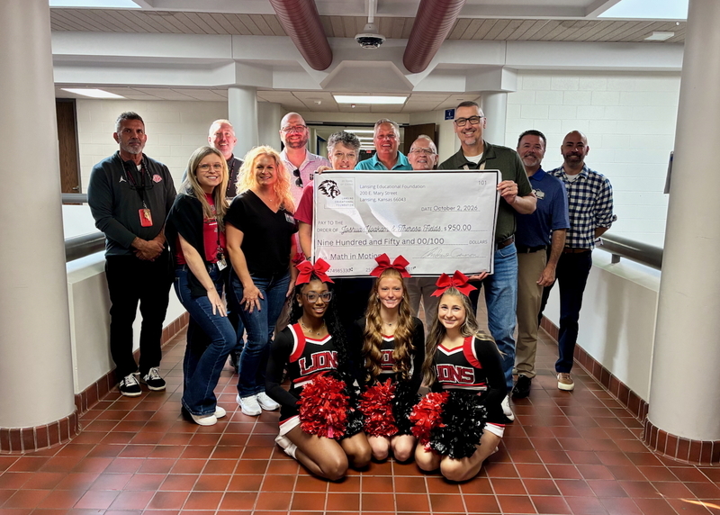 Teacher receiving grant from educational foundation