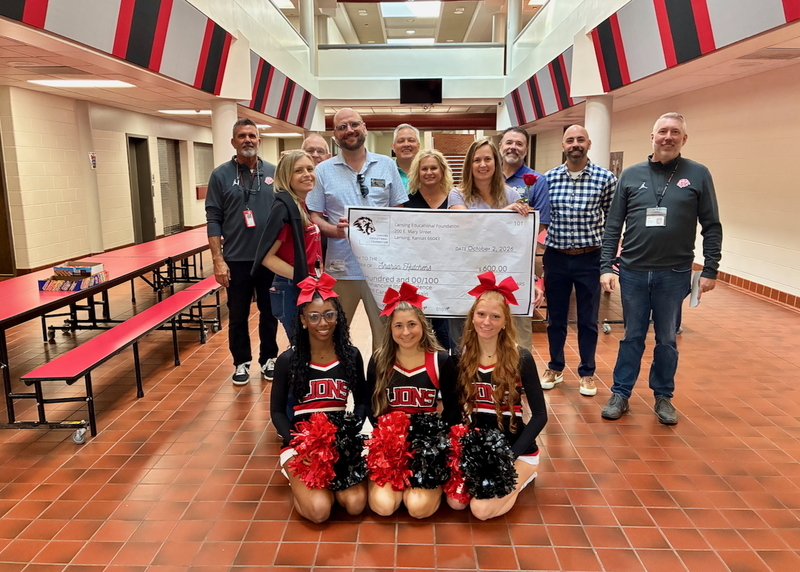 Teacher receiving grant from educational foundation