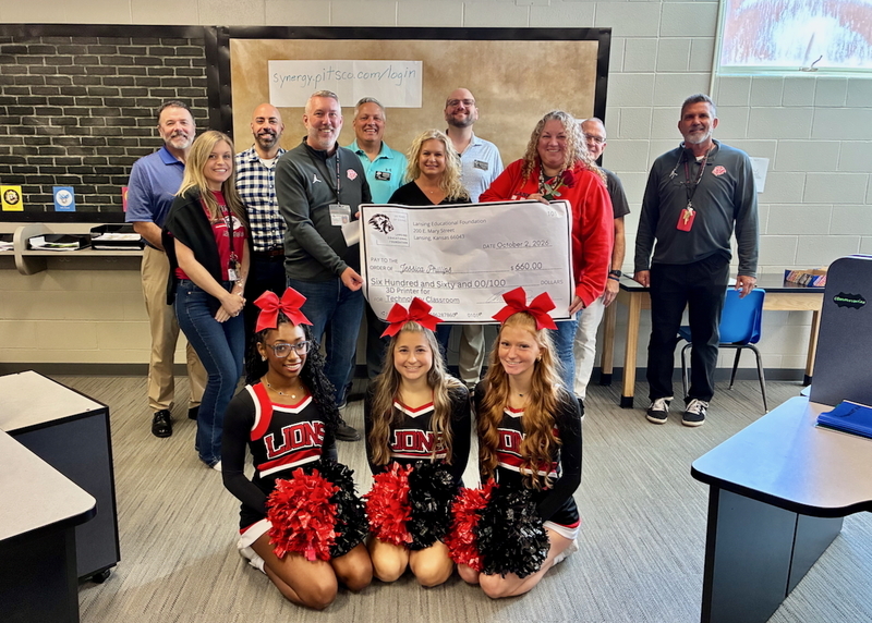 Teacher receiving grant from educational foundation
