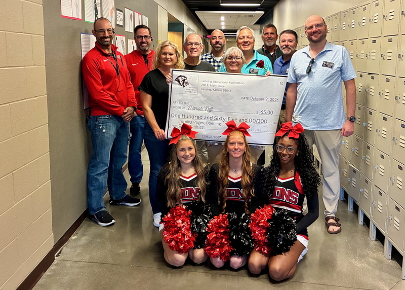 Teacher receiving grant from educational foundation