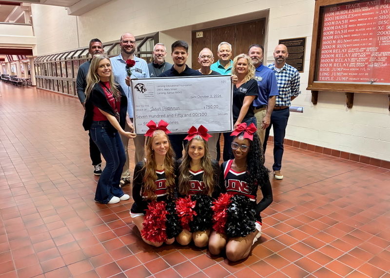 Teacher receiving grant from educational foundation