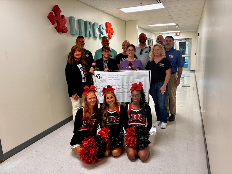 Teacher receiving grant from educational foundation