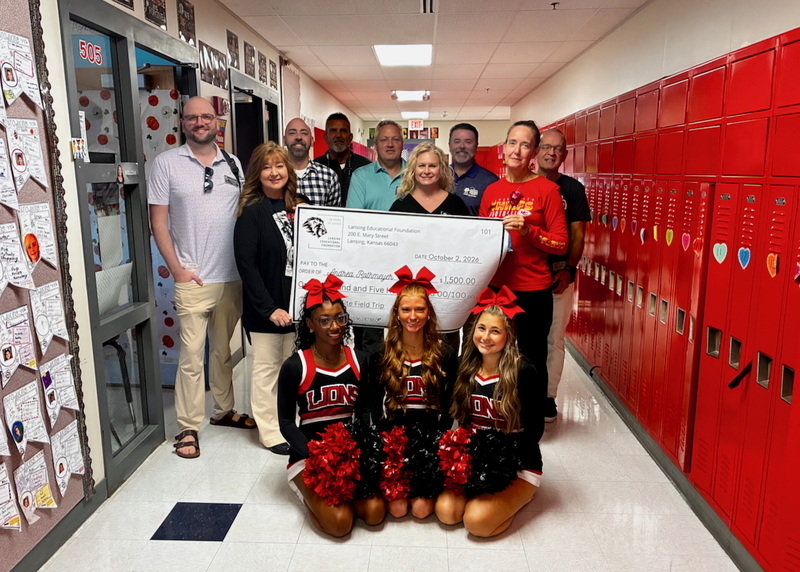 Teacher receiving grant from educational foundation