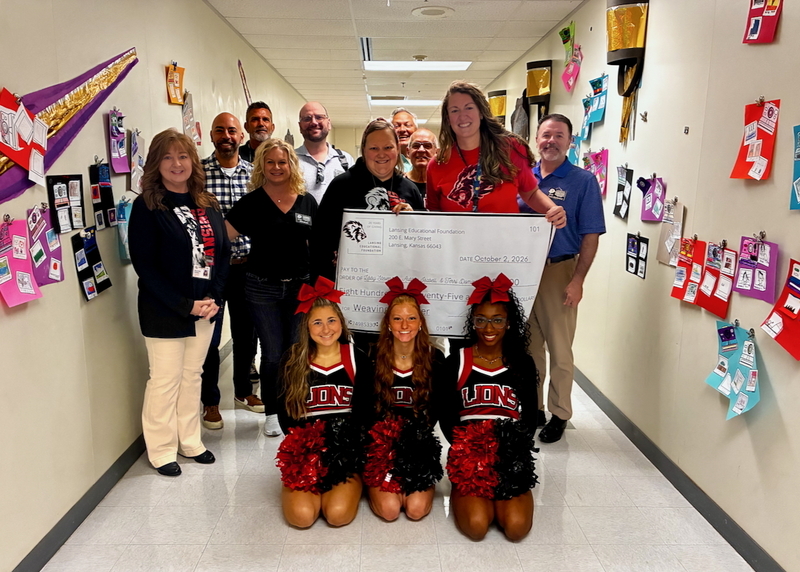 Teacher receiving grant from educational foundation