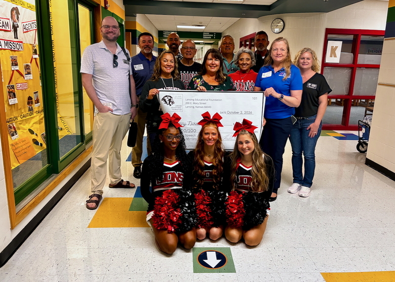 Teacher receiving grant from educational foundation