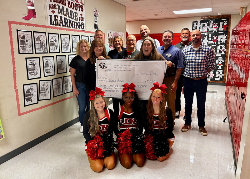 Teacher receiving grant from educational foundation