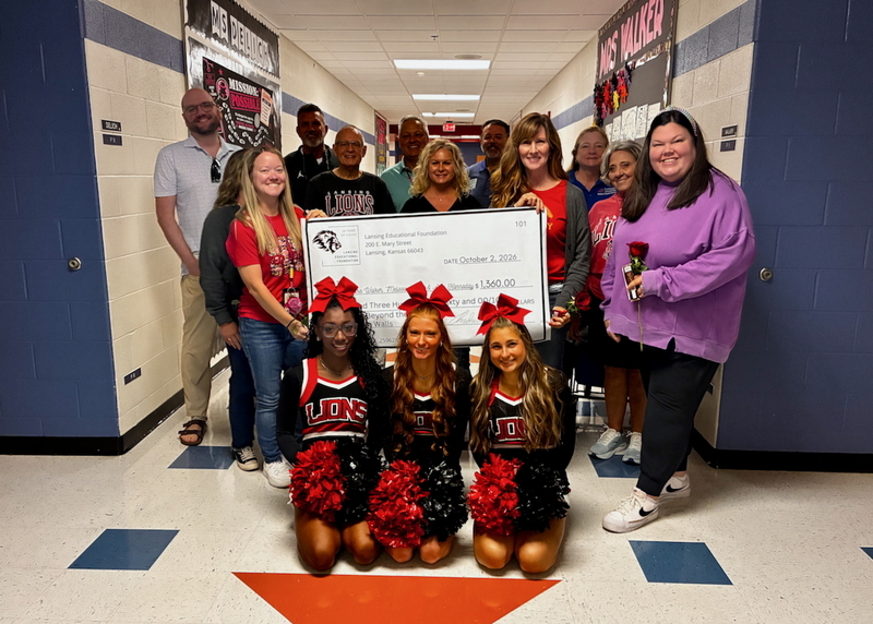 Teacher receiving grant from educational foundation